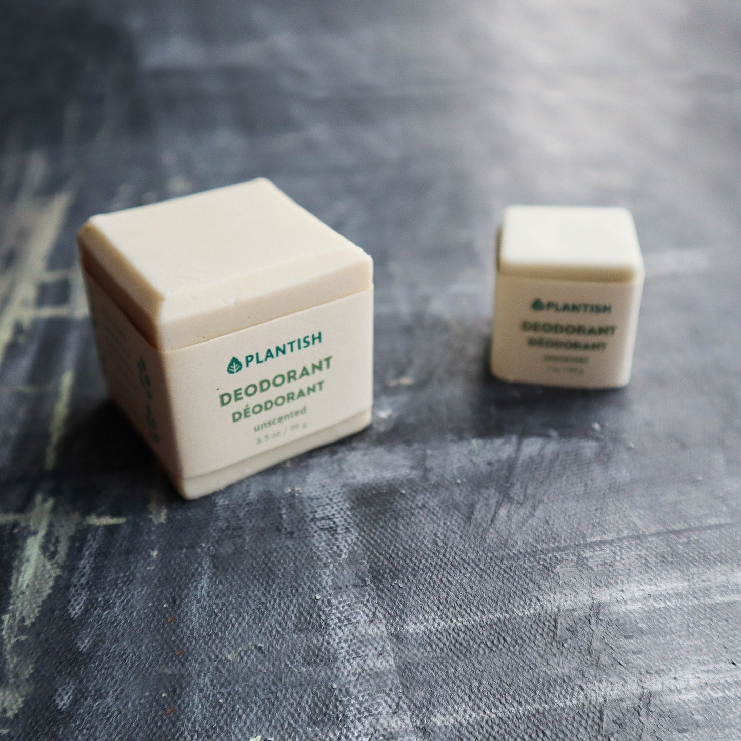 Plantish Future Beauty and Bathroom Zero Waste 2 Deodorant Bars - Front View: Mini (1ounce) white Unscented deodorant bar next to of full (3.5ounce) white unscented deodorant bar)