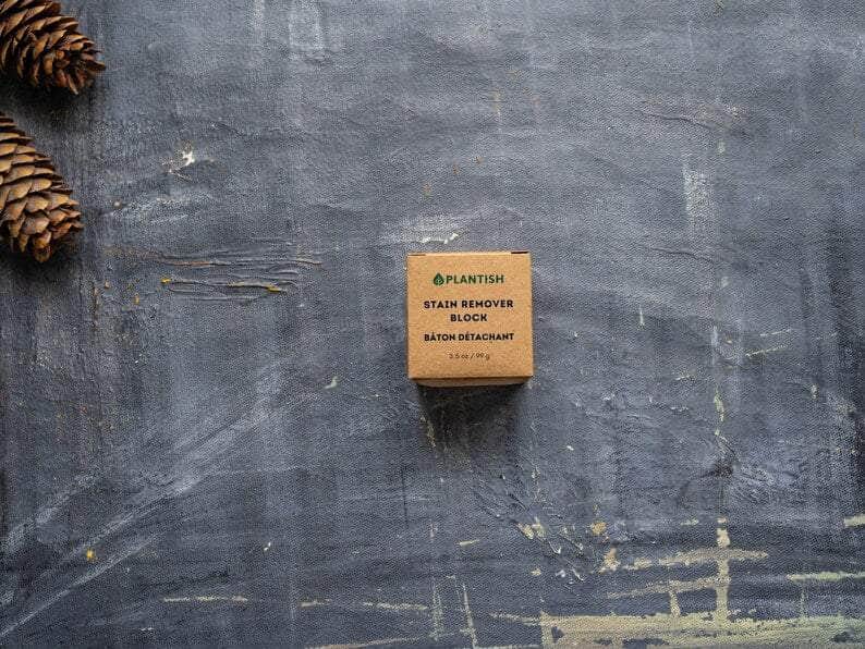 Top View: Plantish Future Home & Kitchen Stain Remover block (3.5oz) in its brown cardboard box with the words "Plantish Stain Remover Block Baton Detachant"