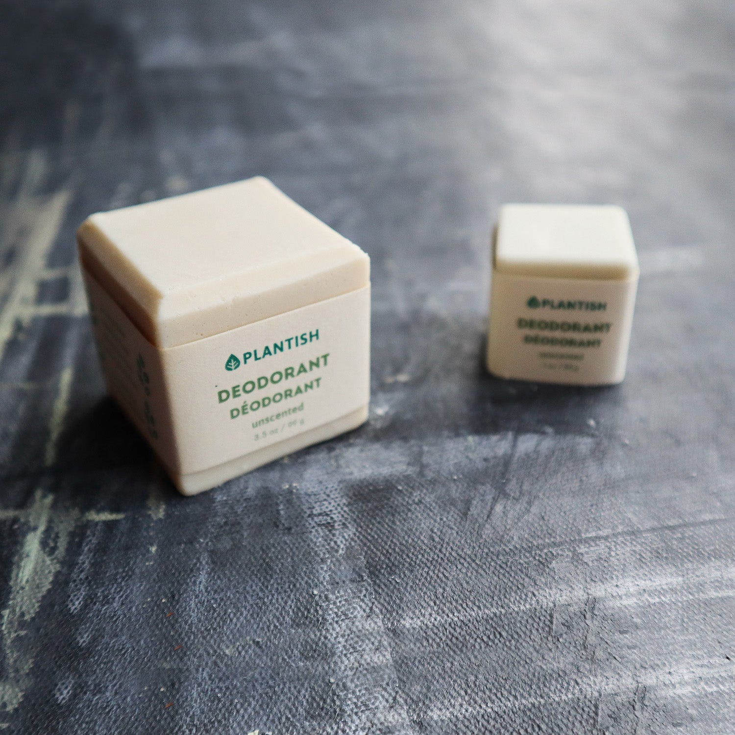 Plantish Future Beauty and Bathroom Zero Waste 2 Deodorant Bars - Front View: Mini (1ounce) white Unscented deodorant bar next to of full (3.5ounce) white unscented deodorant bar)